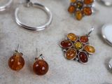 many different types of jewelry displayed on a table