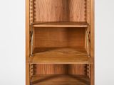 an image of a wooden bookcase with three drawers