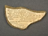 a piece of paper that has been pinned to a piece of cloth