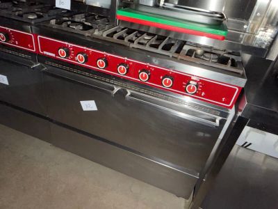 an image of a commercial kitchen with a stove and oven