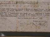 a piece of paper with writing on it in a frame