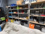 a room with a lot of shelves and bins in it