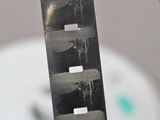 a black and white photo of a person holding a knife