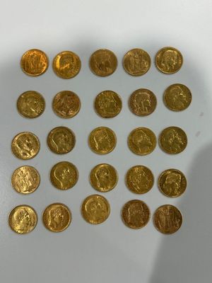 a lot of gold coins that are on the table