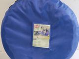 a blue bag with a picture on it hanging on a wall