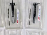 four different types of screws in plastic boxes on a white surface