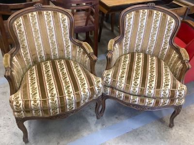 pair of upholstered upholstered chairs in a store