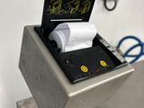 a machine that has a roll of toilet paper in it