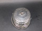 a silver box sitting on top of a black table