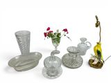 a lot of glass items that are on the table