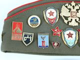 a picture of a bag with a lot of badges on it