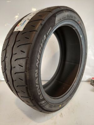 a close up of a tire on a white surface