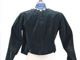 an image of a green jacket on a mannequin