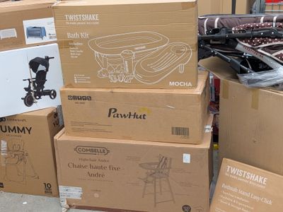 several cardboard boxes stacked on top of each other on a sidewalk