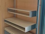 shelves in a room with a blue rug and a blue rug