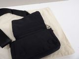 a black bag sitting on top of a white table