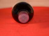 a bottle of wine that is sitting on a table