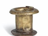 an image of a small metal object on a white surface