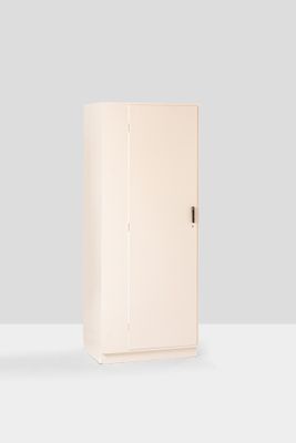 two white cupboards sitting next to each other on a white surface