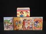 several children ' s books are lined up on a black surface