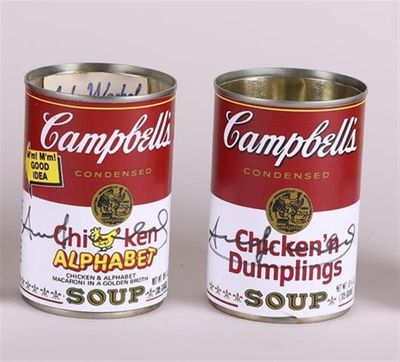 campbell ' s chicken and dumplings soup cans are displayed on a white surface