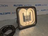 a close up of a light on a table with a cord