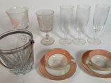 a lot of glassware sitting on a white table