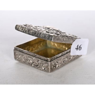 an ornate silver box with a price tag on it