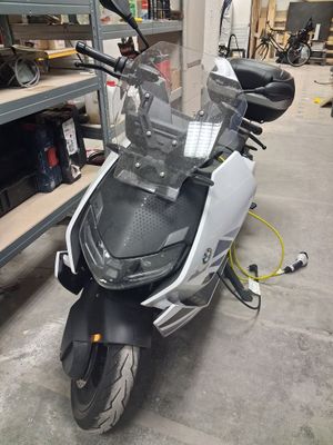 a scooter that is parked in a garage
