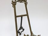 a gold easer with a mirror on it
