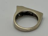 a close up of a silver ring with a cat ' s head on it