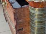 a marble top on the top of a wooden dresser