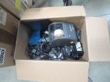 a box full of electronic equipment sitting on the floor