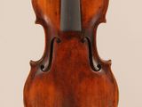 an antique violin with a wooden back and bow