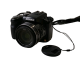 a digital camera with a mouse attached to it
