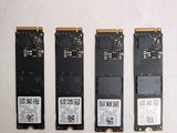 four different types of hard drives are lined up on a white surface