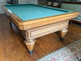 a pool table in the middle of a living room