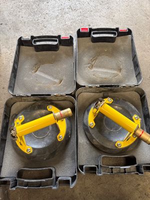 two yellow jacks are sitting in a case on the floor