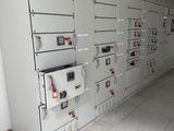 a room with a bunch of electrical equipment on the wall