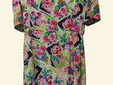 a women ' s dress with a colorful floral pattern on it