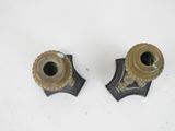 pair of antique brass candlesticks on a white background