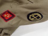 a close up of a uniform with a badge on it