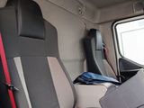 a seat in the back of a truck with a laptop on it