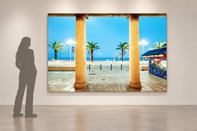a woman standing in front of a painting in an art gallery