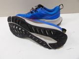 the sole of a pair of running shoes on a white surface
