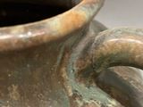 a close up of a vase on a table