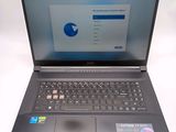 a laptop that is open on a white surface