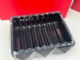 a lot of knives that are in a plastic box