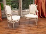 two chairs that are sitting in front of a window