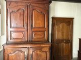 a large wooden cabinet in the corner of a room